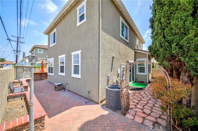 8647 Belmont St, Cypress, CA 90630 - rear view of house featuring a patio, stucco siding, and a fenced backyard