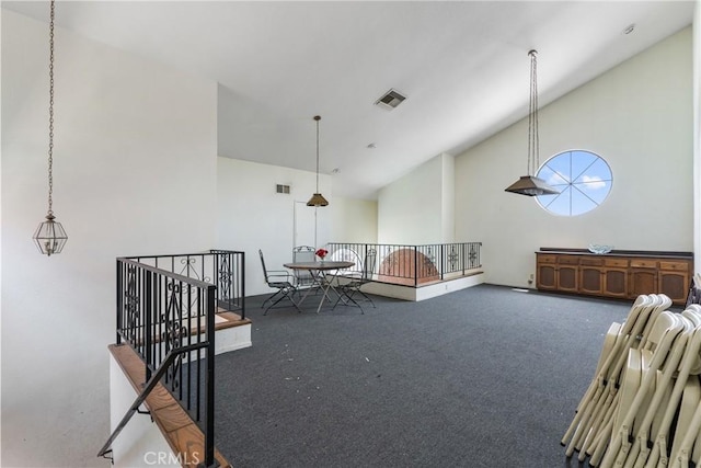 7625 Reseda Blvd Unit 302, Reseda, CA 91335 - living area featuring an upstairs landing, high vaulted ceiling, and carpet