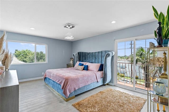 7625 Reseda Blvd Unit 302, Reseda, CA 91335 - bedroom with access to outside, multiple windows, wood finished floors, and recessed lighting