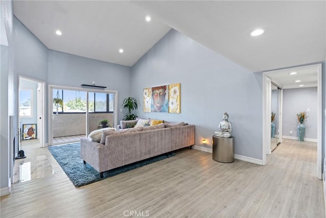 7625 Reseda Blvd Unit 302, Reseda, CA 91335 - living room featuring high vaulted ceiling, wood finished floors, and recessed lighting