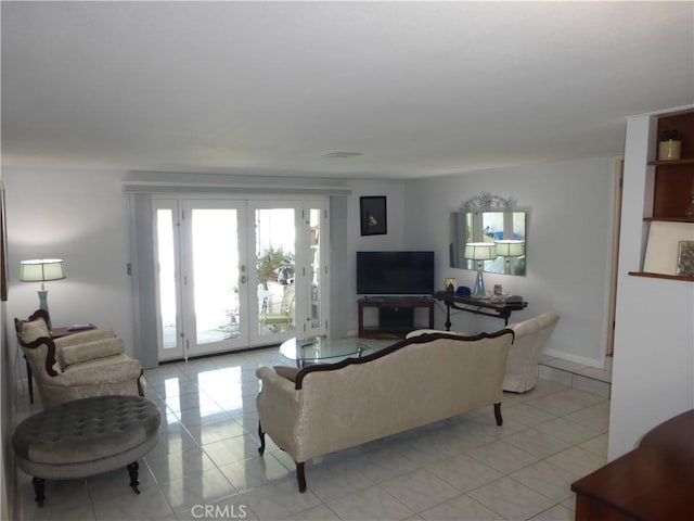 7106 Elmwood Rd, San Bernardino, CA 92404 - living area with light tile patterned floors and french doors