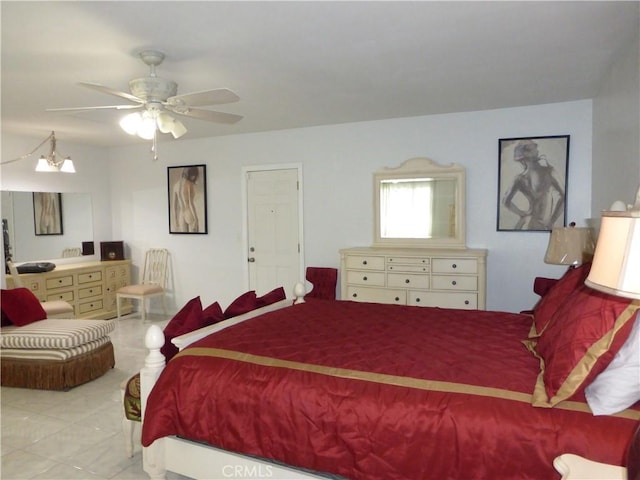 7106 Elmwood Rd, San Bernardino, CA 92404 - tiled bedroom with ceiling fan