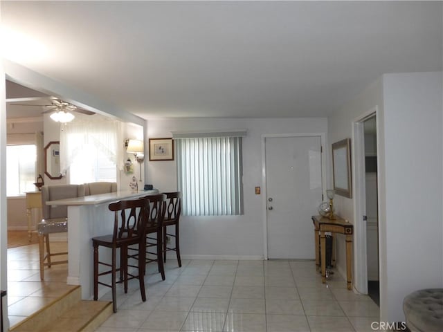 7106 Elmwood Rd, San Bernardino, CA 92404 - entryway featuring plenty of natural light, light tile patterned flooring, and a ceiling fan