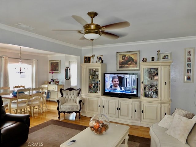 7106 Elmwood Rd, San Bernardino, CA 92404 - living room featuring wood finished floors, ceiling fan, and ornamental molding