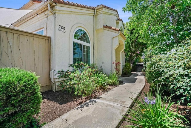 750 Breeze Hill Rd Unit 112, Vista, CA 92081 - doorway to property with stucco siding and a tiled roof