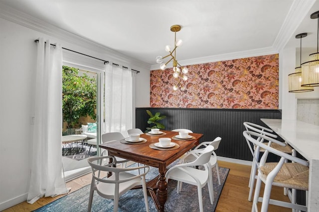 750 Breeze Hill Rd Unit 112, Vista, CA 92081 - dining space with a chandelier, wainscoting, crown molding, and light wood-style flooring