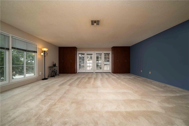 2527 Gibbons St, El Cajon, CA 92020 - unfurnished living room with carpet, healthy amount of natural light, and a textured ceiling