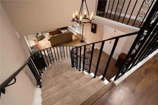 2527 Gibbons St, El Cajon, CA 92020 - stairs featuring a chandelier, wood finished floors, and a high ceiling