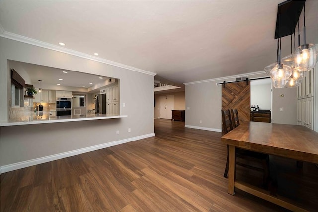 2527 Gibbons St, El Cajon, CA 92020 - unfurnished living room featuring a barn door, ornamental molding, wood finished floors, and recessed lighting