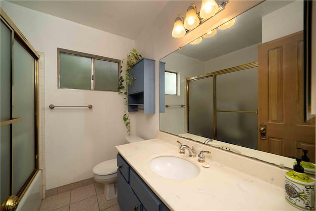 2527 Gibbons St, El Cajon, CA 92020 - full bathroom with vanity, tile patterned flooring, and bath / shower combo with glass door