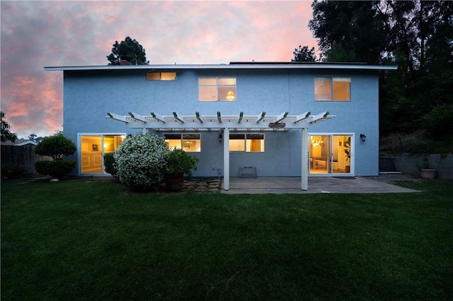 2527 Gibbons St, El Cajon, CA 92020 - back of property at dusk featuring a pergola, a patio, and stucco siding