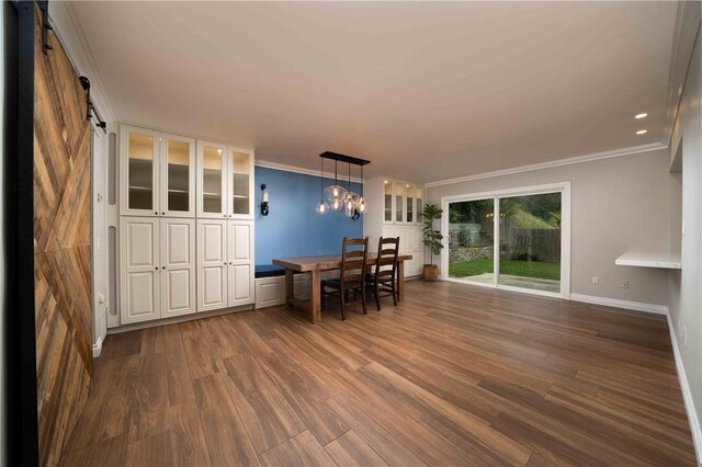 2527 Gibbons St, El Cajon, CA 92020 - dining space with dark wood-type flooring, crown molding, a barn door, and a chandelier