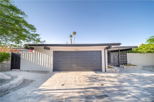 73466 Salt, Cedar, Palm Desert, CA 92260 - view of front of house with concrete driveway and an attached garage