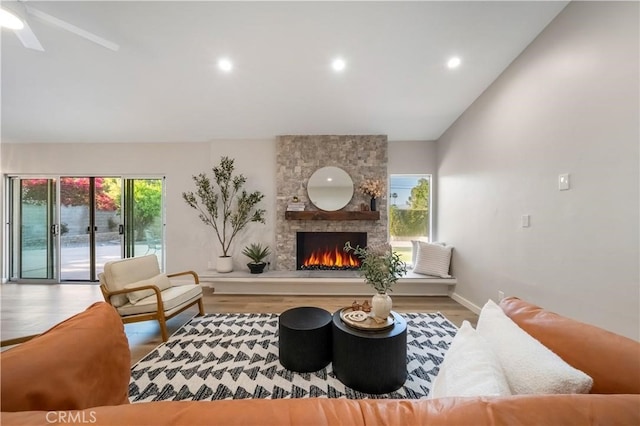 73466 Salt, Cedar, Palm Desert, CA 92260 - living room with wood finished floors, a stone fireplace, lofted ceiling, recessed lighting, and ceiling fan
