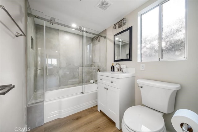 73466 Salt, Cedar, Palm Desert, CA 92260 - bathroom with vanity, combined bath / shower with glass door, plenty of natural light, and wood finished floors