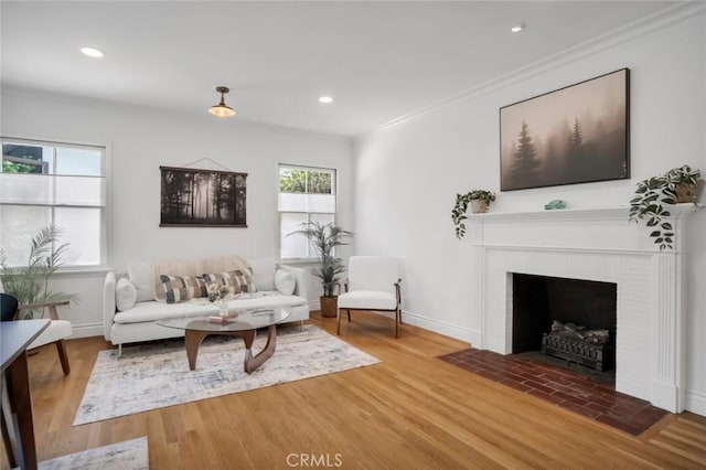 1000 N Chester Ave, Pasadena, CA 91104 - living room featuring crown molding, recessed lighting, wood finished floors, and a fireplace