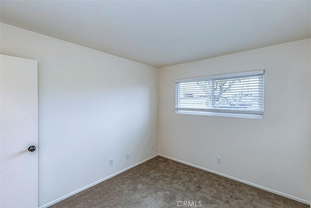 15015 Tacuba Dr, La Mirada, CA 90638 - carpeted empty room with baseboards