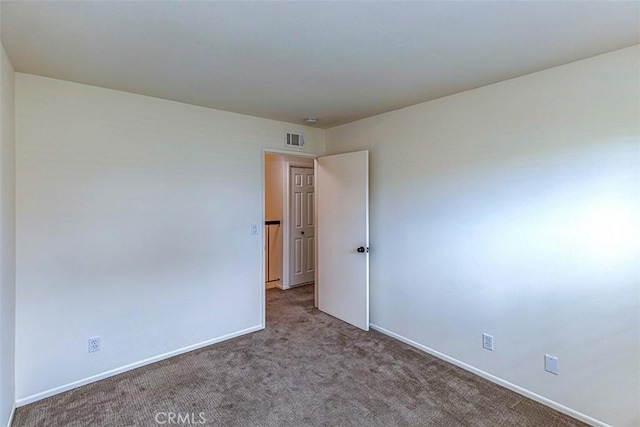 15015 Tacuba Dr, La Mirada, CA 90638 - unfurnished room with carpet floors and baseboards