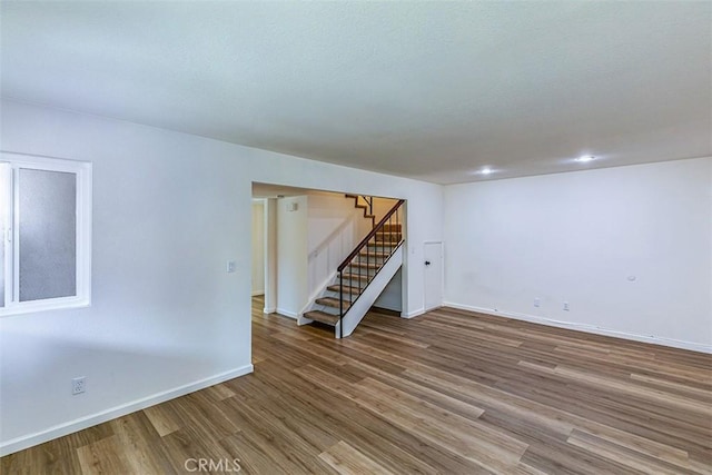 15015 Tacuba Dr, La Mirada, CA 90638 - spare room with stairway and wood finished floors