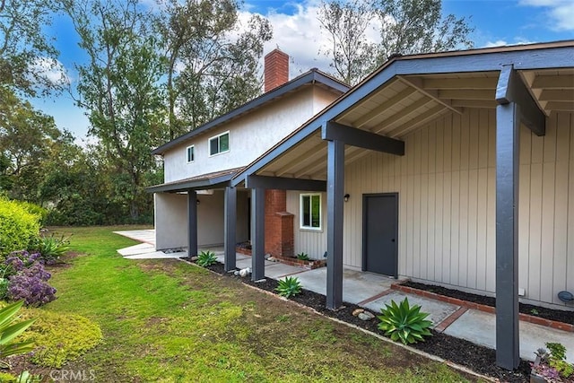 15015 Tacuba Dr, La Mirada, CA 90638 - rear view of property with a patio area, a yard, and a chimney