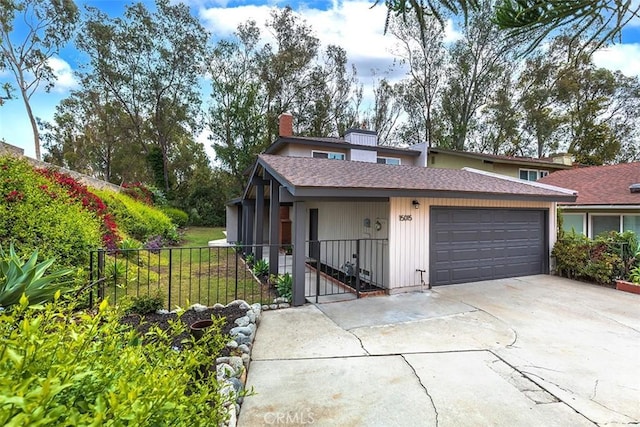 15015 Tacuba Dr, La Mirada, CA 90638 - view of front of house featuring driveway, an attached garage, roof with shingles, and a chimney