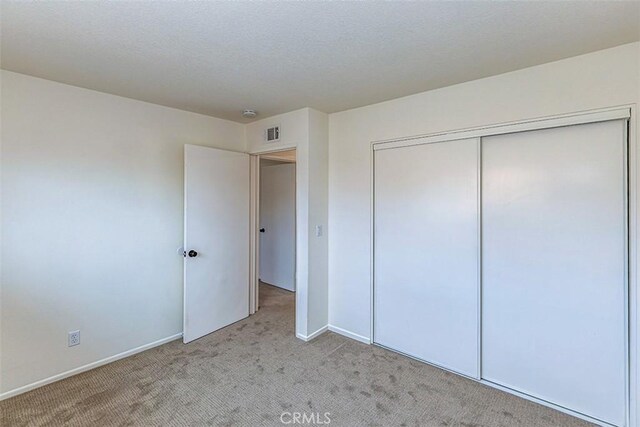 15015 Tacuba Dr, La Mirada, CA 90638 - unfurnished bedroom featuring light carpet and a closet