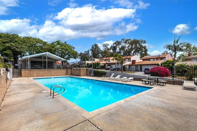 15015 Tacuba Dr, La Mirada, CA 90638 - community pool with a patio area and a residential view