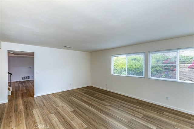 15015 Tacuba Dr, La Mirada, CA 90638 - unfurnished room featuring plenty of natural light and wood finished floors
