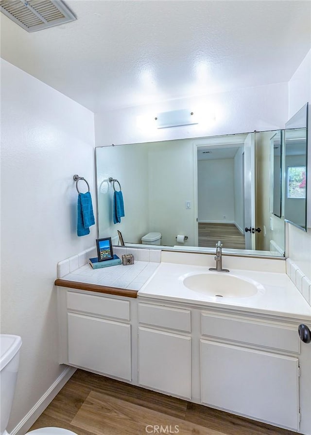 15015 Tacuba Dr, La Mirada, CA 90638 - bathroom featuring wood finished floors and vanity