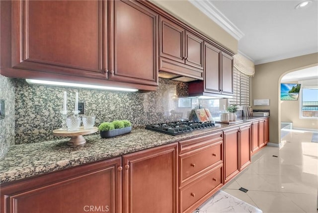 1411 W Boros Ct, La Habra, CA 90631 - kitchen featuring stainless steel gas stovetop, arched walkways, decorative backsplash, light marble finish floors, and crown molding