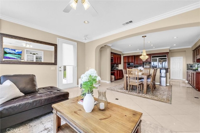 1411 W Boros Ct, La Habra, CA 90631 - living area with ceiling fan, arched walkways, light tile patterned floors, recessed lighting, and crown molding