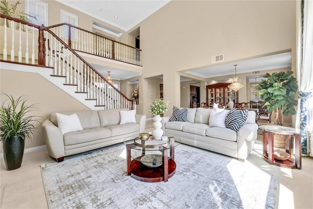 1411 W Boros Ct, La Habra, CA 90631 - living area featuring crown molding, stairs, a towering ceiling, carpet flooring, and a chandelier