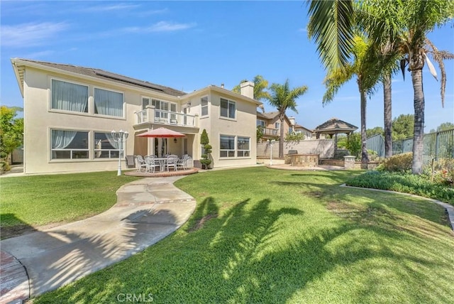 1411 W Boros Ct, La Habra, CA 90631 - back of property featuring solar panels, a balcony, a patio, stucco siding, and a gazebo