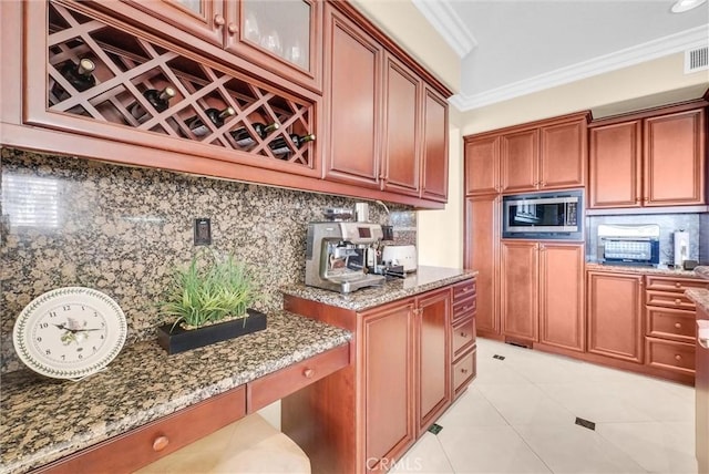 1411 W Boros Ct, La Habra, CA 90631 - kitchen with stainless steel microwave, backsplash, light stone countertops, crown molding, and light tile patterned flooring