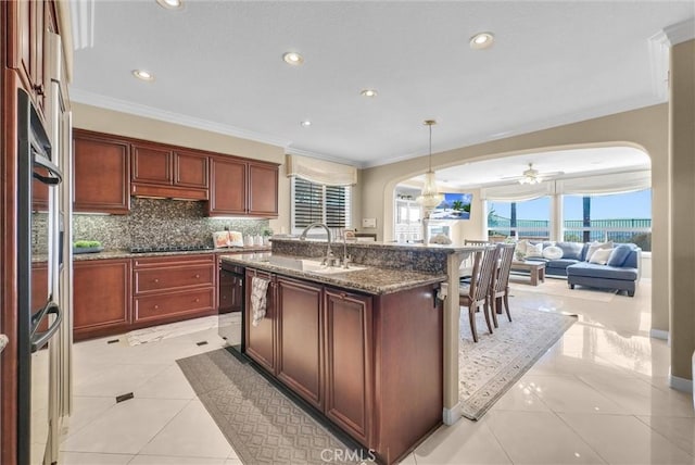 1411 W Boros Ct, La Habra, CA 90631 - kitchen featuring arched walkways, ornamental molding, a ceiling fan, tasteful backsplash, and open floor plan