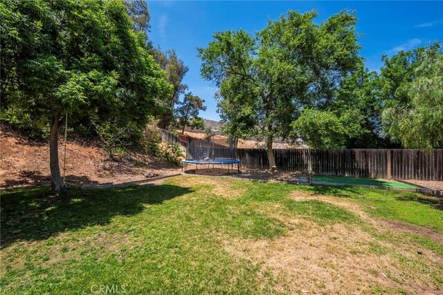 11359 Dole Ct, Riverside, CA 92505 - fenced backyard featuring a trampoline