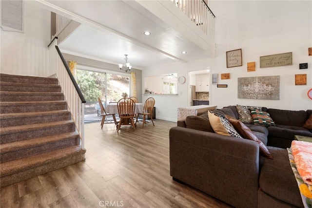 11359 Dole Ct, Riverside, CA 92505 - living room with wood finished floors, stairs, and a chandelier
