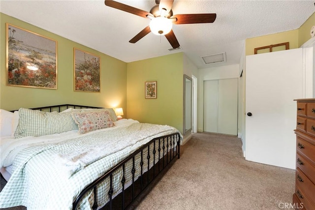 11359 Dole Ct, Riverside, CA 92505 - bedroom featuring attic access, light colored carpet, a ceiling fan, and a closet