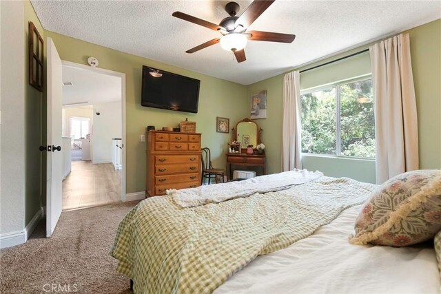 11359 Dole Ct, Riverside, CA 92505 - carpeted bedroom featuring a textured ceiling and ceiling fan