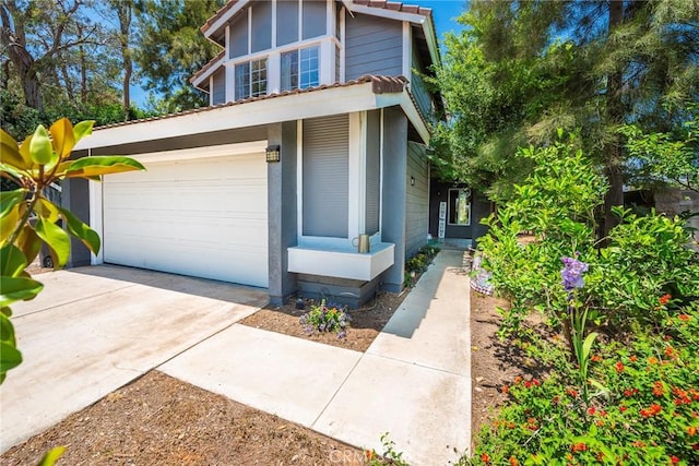 11359 Dole Ct, Riverside, CA 92505 - view of front facade with a garage and driveway