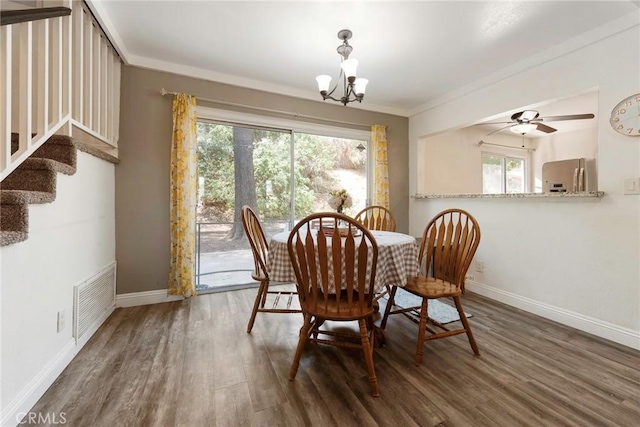 11359 Dole Ct, Riverside, CA 92505 - dining room with wood finished floors, a chandelier, stairs, and ceiling fan