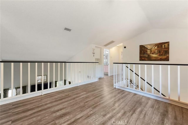 11359 Dole Ct, Riverside, CA 92505 - empty room with vaulted ceiling and wood finished floors