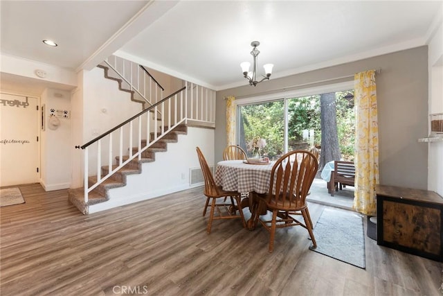 11359 Dole Ct, Riverside, CA 92505 - dining space featuring stairs, wood finished floors, a chandelier, and ornamental molding