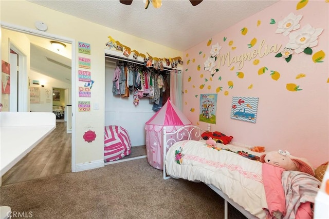 11359 Dole Ct, Riverside, CA 92505 - bedroom with carpet floors, a closet, a textured ceiling, and a ceiling fan