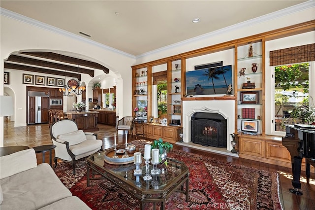 15 Sarteano Dr, Newport Coast, CA 92657 - living room featuring arched walkways, beam ceiling, a lit fireplace, crown molding, and recessed lighting