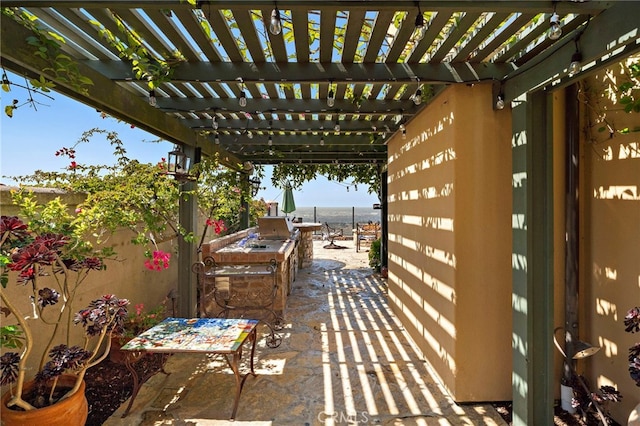15 Sarteano Dr, Newport Coast, CA 92657 - view of patio / terrace with a pergola and exterior kitchen