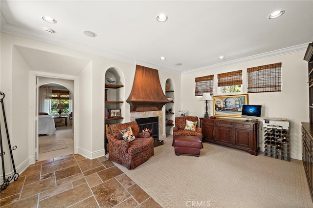 15 Sarteano Dr, Newport Coast, CA 92657 - living room featuring ornamental molding, built in features, recessed lighting, a fireplace, and stone tile floors
