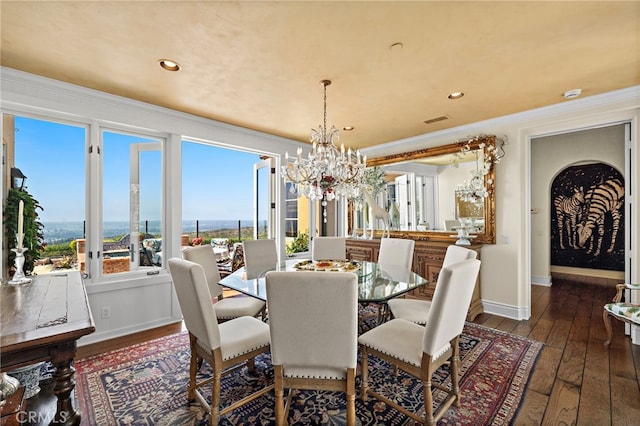 15 Sarteano Dr, Newport Coast, CA 92657 - dining room with a chandelier, dark wood finished floors, ornamental molding, and recessed lighting