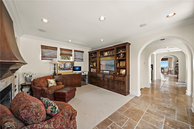 15 Sarteano Dr, Newport Coast, CA 92657 - living room with arched walkways, crown molding, recessed lighting, stone tile floors, and a high end fireplace