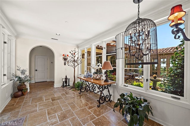 15 Sarteano Dr, Newport Coast, CA 92657 - sunroom with arched walkways and a chandelier